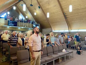 Congregation worshiping together in the sanctuary